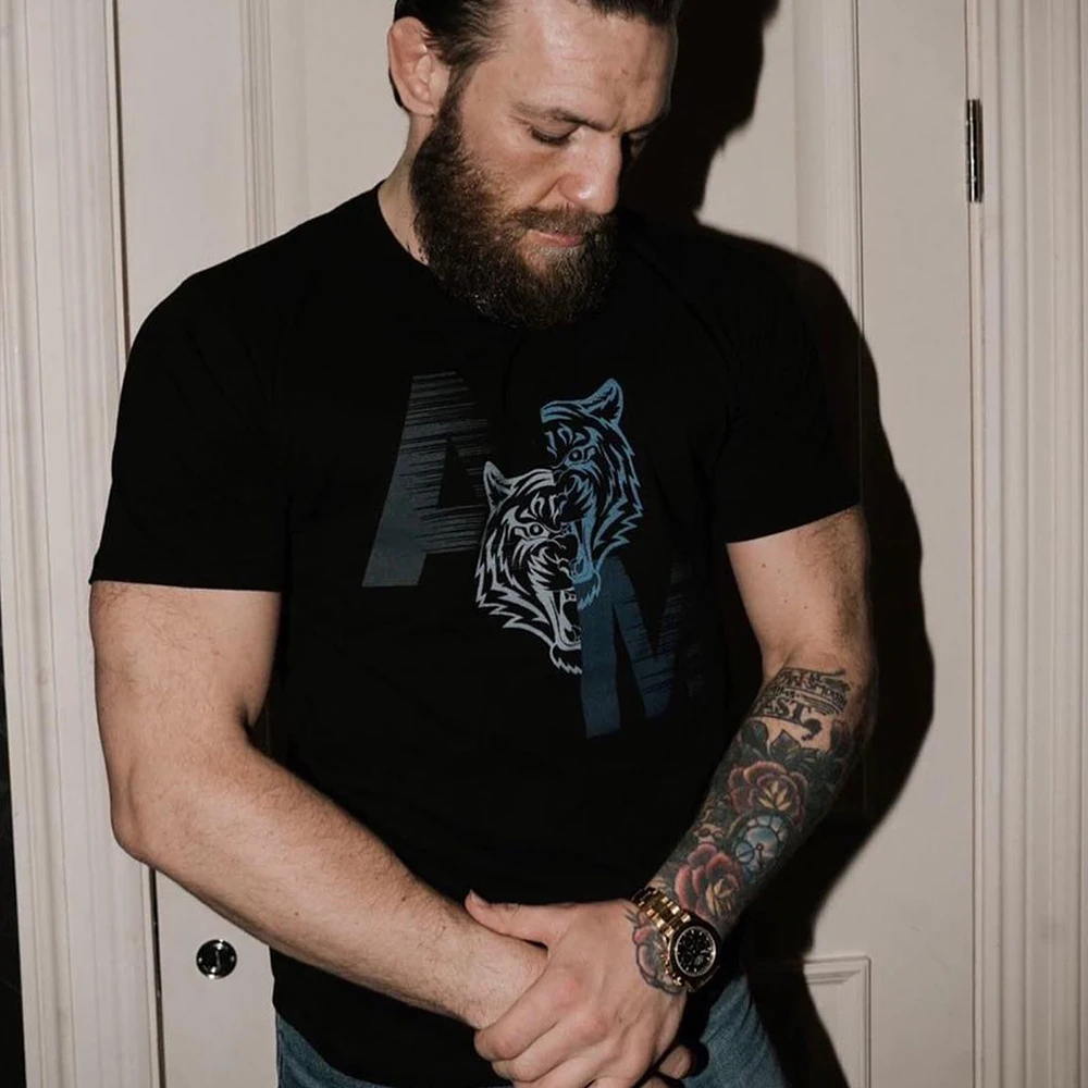 Conor McGregor fights swordsman Jiu-jitsu T-shirt fitness Muay Thai tiger MMA short-sleeved MIXED martial arts training exercise
Conor McGregor fights swordsman Jiu-jitsu T-shirt fitness Muay Thai tiger MMA short-sleeved MIXED martial arts training exercise