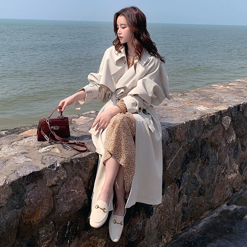 Han edition popular spot windbreaker female in the new long coat loose over-the-knee popular British wind coat 
Han edition popular spot windbreaker female in the new long coat loose over-the-knee popular British wind coat