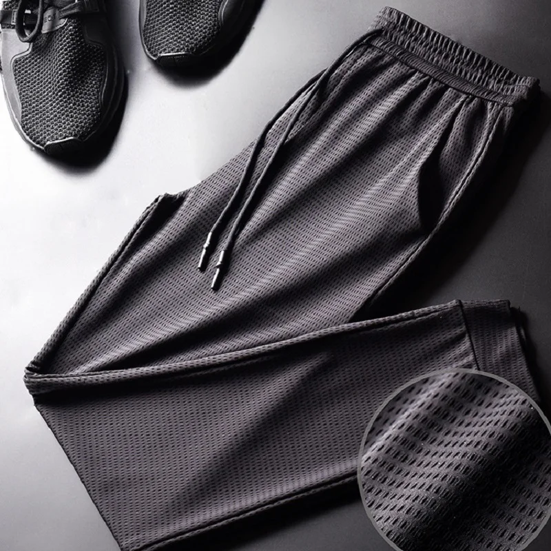 Summer Thin Ice Silk Pants Men's Loose Sports Pants Feet Stretch Nine-point Pants Quick-drying Breathable Air-conditioned Pants
Summer Thin Ice Silk Pants Men's Loose Sports Pants Feet Stretch Nine-point Pants Quick-drying Breathable Air-conditioned Pants