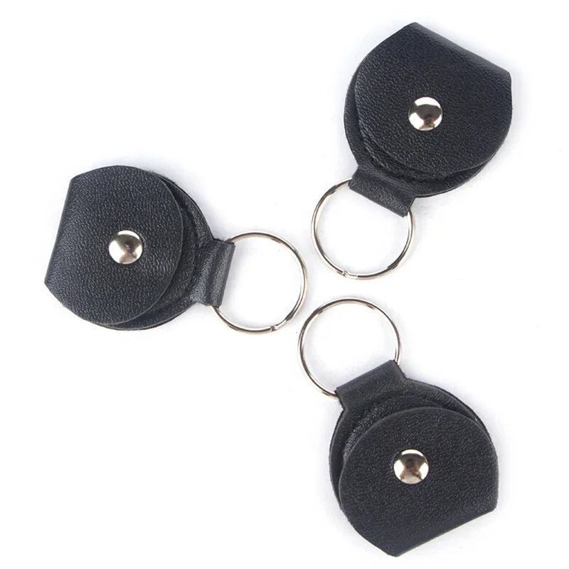 Top Quality Guitar Pick Holder Genuine Leather Guitarra Plectrum Case Bag Keychain Shape Guitar Accessories 
Top Quality Guitar Pick Holder Genuine Leather Guitarra Plectrum Case Bag Keychain Shape Guitar Accessories