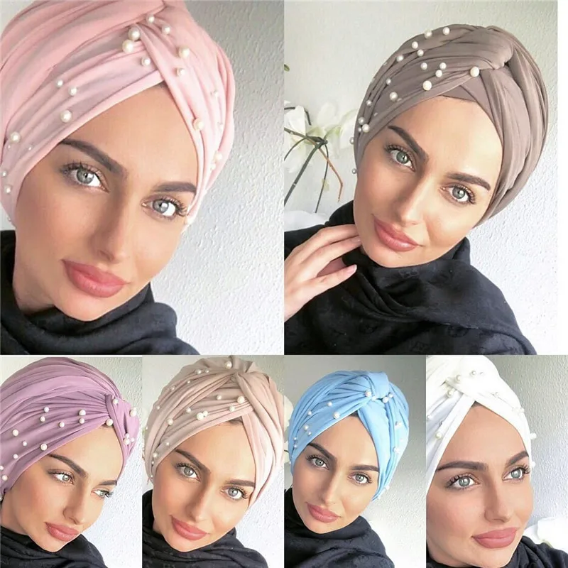 2021 Trendy Women Suede Pearls Turban Caps Muslim Inner Hijabs Twist African India Cap Female Islamic Head Wrap Turbante Bonnet 
2021 Trendy Women Suede Pearls Turban Caps Muslim Inner Hijabs Twist African India Cap Female Islamic Head Wrap Turbante Bonnet