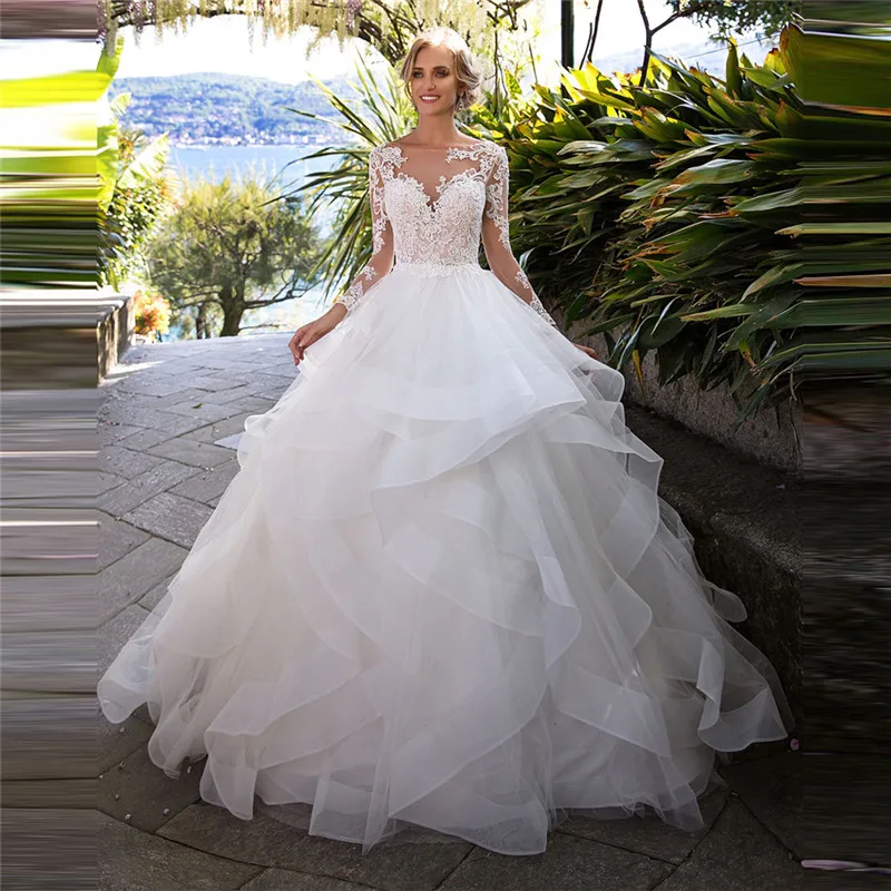 2021 New Beautiful Ball Gown Ruffles Wedding Dress Lace Appliques Long Sleeves Puffy Bridal Gowns Buttons Back Princess Tulle
2021 New Beautiful Ball Gown Ruffles Wedding Dress Lace Appliques Long Sleeves Puffy Bridal Gowns Buttons Back Princess Tulle