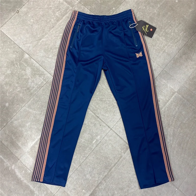Sea Blue Needles Pants Men Women Stripe Butterfly Embroidery Logo Ribbon Needles Track Pants High Street Trousers 
Sea Blue Needles Pants Men Women Stripe Butterfly Embroidery Logo Ribbon Needles Track Pants High Street Trousers