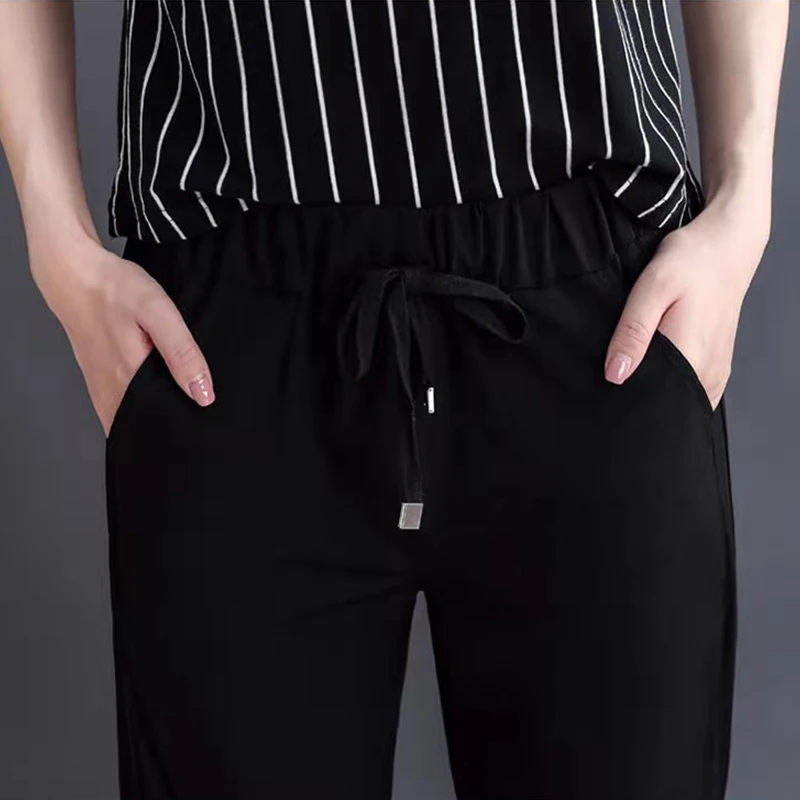 S-4XL Lady Plus Size Mesh Patchwork Elastic Waist Sports Thin Harem Cool Pants Black Quick-drying Drawstring Women Trousers 2021
S-4XL Lady Plus Size Mesh Patchwork Elastic Waist Sports Thin Harem Cool Pants Black Quick-drying Drawstring Women Trousers 2021