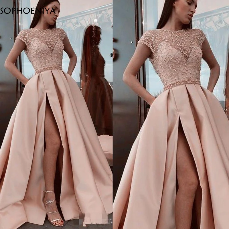Elegant Satin Pink Dubai Arabic Evening dress 2023 Cap sleeve Lace Beaded Formal dress Party Caftan mariage Galajurk
Elegant Satin Pink Dubai Arabic Evening dress 2023 Cap sleeve Lace Beaded Formal dress Party Caftan mariage Galajurk
