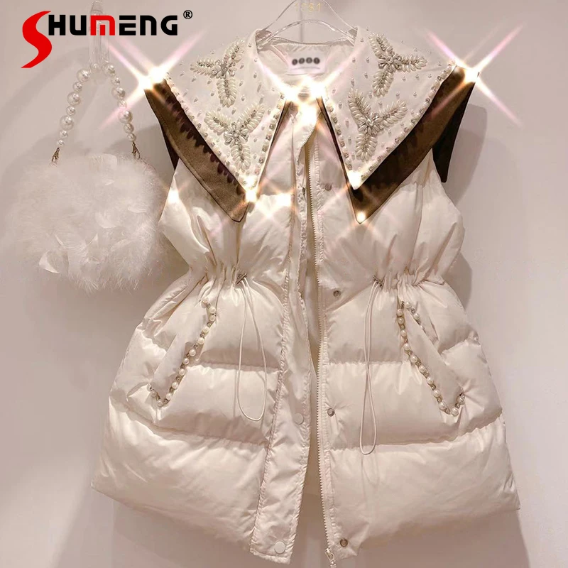 Women's Cotton Padded Coat Vest Winter 2021 New Sweet Beaded Doll Collar Waist-Tight Slimming Thickened Cotton Padded Waistcoats
Women's Cotton Padded Coat Vest Winter 2021 New Sweet Beaded Doll Collar Waist-Tight Slimming Thickened Cotton Padded Waistcoats