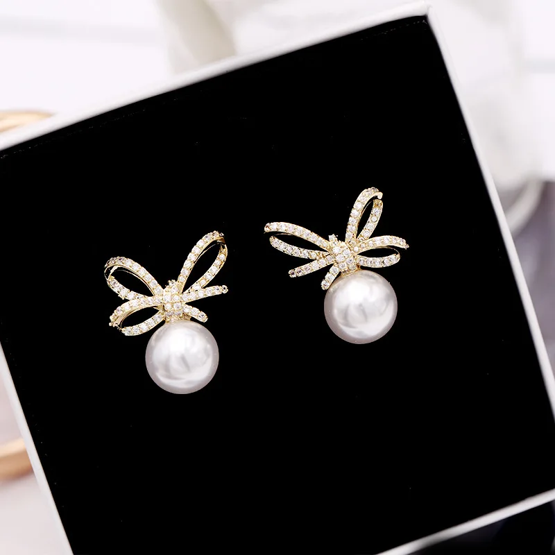 2021 New Korean Version of Bow Tie Pearl Earrings S925 Silver Needle Stud Earrings Fashion Personality Sweet Popular Earrings
2021 New Korean Version of Bow Tie Pearl Earrings S925 Silver Needle Stud Earrings Fashion Personality Sweet Popular Earrings