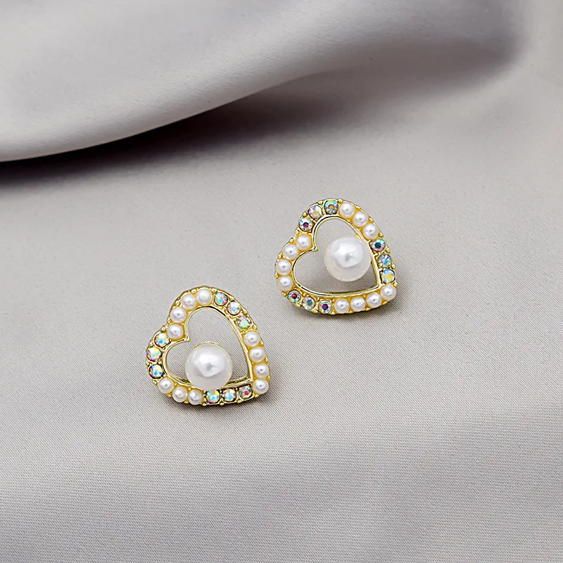 925 silver needle love AB color pearl earrings simple wild earrings Japan and South Korea new net red earrings
925 silver needle love AB color pearl earrings simple wild earrings Japan and South Korea new net red earrings