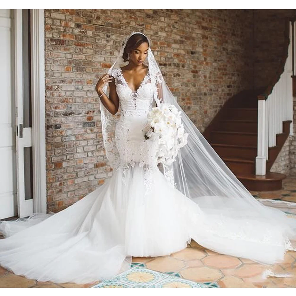 African Mermaid Wedding Dresses Deep V Neck Cap Sleeve Backless Lace Appliques Beads Bridal Gowns vestido de noiva
African Mermaid Wedding Dresses Deep V Neck Cap Sleeve Backless Lace Appliques Beads Bridal Gowns vestido de noiva