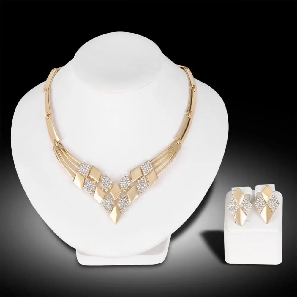 Women KC Gold Plated Rhombus Shape Necklace Earrings Rhinestones Jewelry Set Fashion and unique styling
Women KC Gold Plated Rhombus Shape Necklace Earrings Rhinestones Jewelry Set Fashion and unique styling
