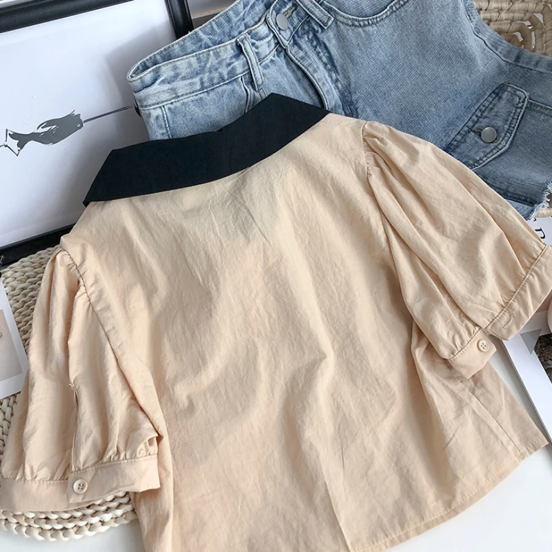 KUSAHIKI Hit Color Turn-down Collar Blouse Women Puff Short Sleeve Tops 2021 Summer Single Breasted Blusas Mujer De Moda 6G688
KUSAHIKI Hit Color Turn-down Collar Blouse Women Puff Short Sleeve Tops 2021 Summer Single Breasted Blusas Mujer De Moda 6G688