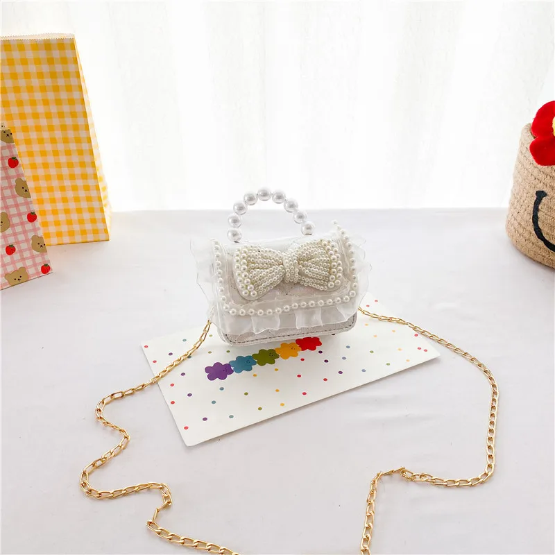 Children Bag 2021 Summer New Single Shoulder Cute Little Fragrant Pearl Messenger Fashionable Girl Chain 
Children Bag 2021 Summer New Single Shoulder Cute Little Fragrant Pearl Messenger Fashionable Girl Chain
