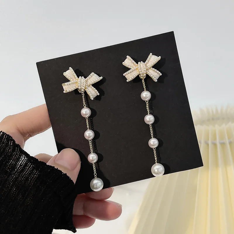 S925 Silver Needle New Bowknot Pearl Tassel Earrings Super Fairy Temperament Atmosphere Sense A Pair of Earrings Earring Korean
S925 Silver Needle New Bowknot Pearl Tassel Earrings Super Fairy Temperament Atmosphere Sense A Pair of Earrings Earring Korean