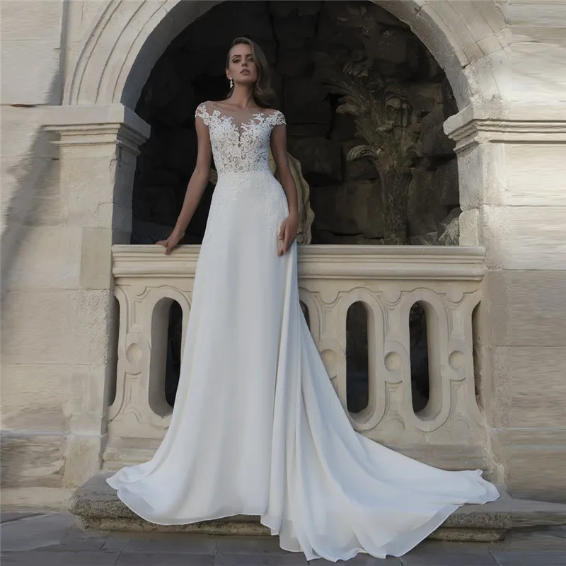 Прозрачные Свадебные платья трапециевидной формы с короткими рукавами и кружевной аппликацией; Свадебные платья с пуговицами на спине; Мод...
Прозрачные Свадебные платья трапециевидной формы с короткими рукавами и кружевной аппликацией; Свадебные платья с пуговицами на спине; Мод...