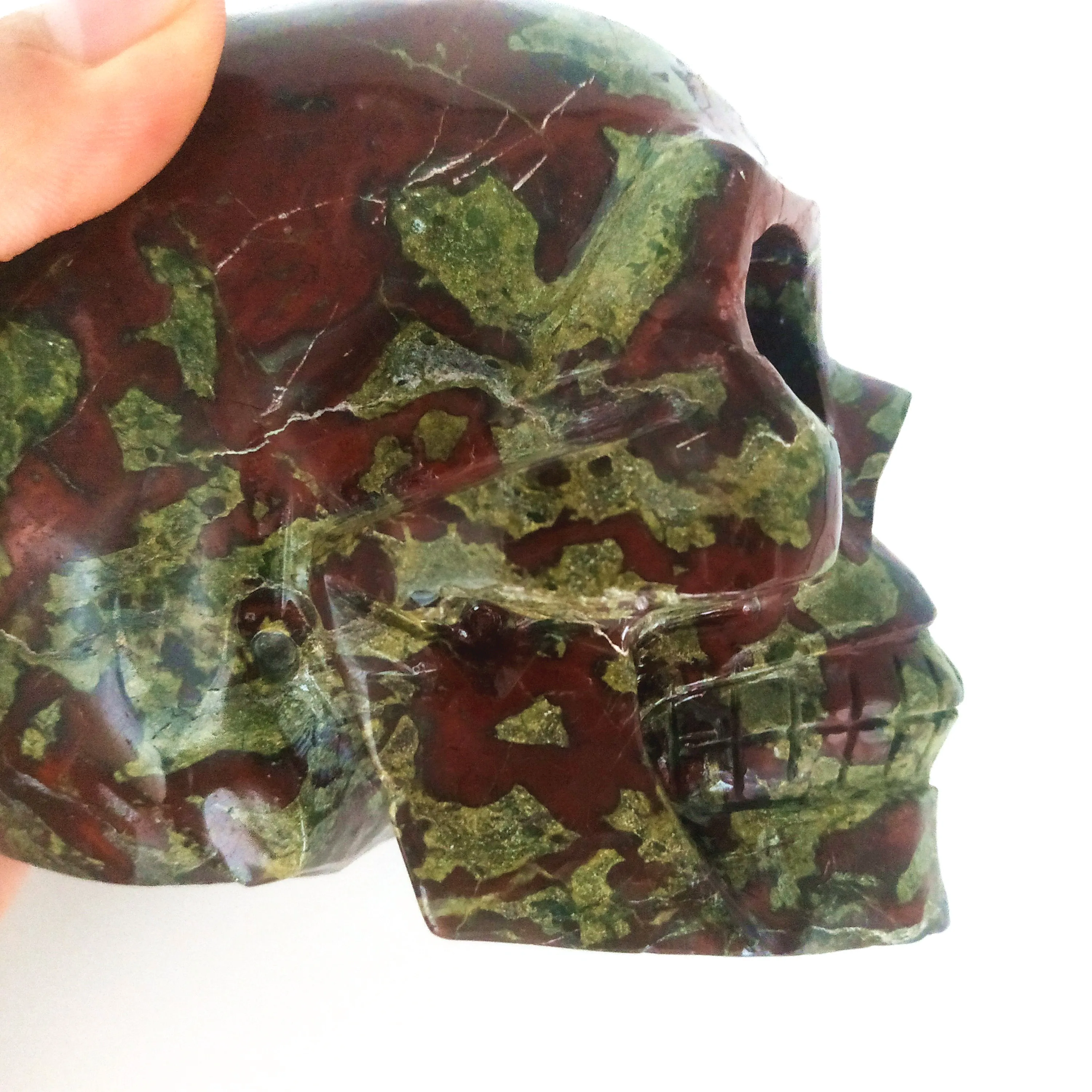 800-1000g Natural Quartz Crystal Skull Dragon Blood Skull Top Quality Crystal Carvings Big Skull Home Decoration
800-1000g Natural Quartz Crystal Skull Dragon Blood Skull Top Quality Crystal Carvings Big Skull Home Decoration