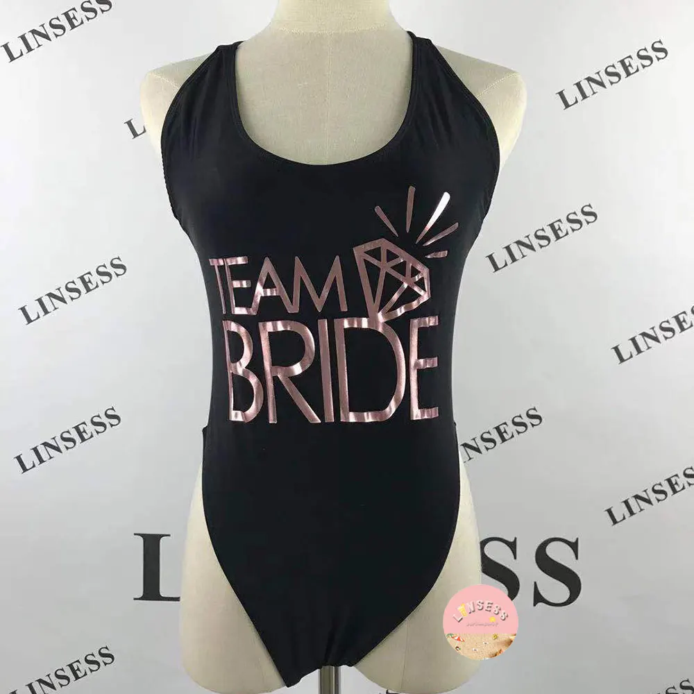 Team Bride With Ring Black High Waist Swimsuit One Piece Back Cross Sexy Beach Bridesmaid Swimwear Wedding Summer Swim Suit 2021
Team Bride With Ring Black High Waist Swimsuit One Piece Back Cross Sexy Beach Bridesmaid Swimwear Wedding Summer Swim Suit 2021