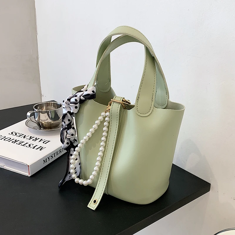Ladies simple small PU leather bucket bag 2021 new fashion ladies silk scarf pearl messenger bag handbag
Ladies simple small PU leather bucket bag 2021 new fashion ladies silk scarf pearl messenger bag handbag