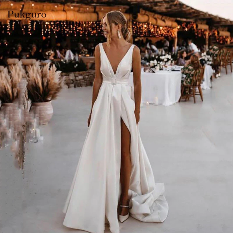 Pukguro Stain Beach Wedding Dress A Line Sexy V Neck Backless Side Split Bridal Dresses With Belt Robe mariage Custom Made
Pukguro Stain Beach Wedding Dress A Line Sexy V Neck Backless Side Split Bridal Dresses With Belt Robe mariage Custom Made