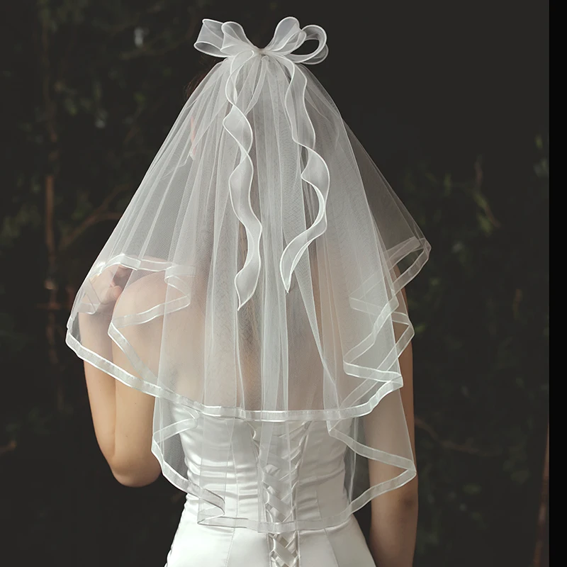 V713 Elegant Elbow Length White Bridal Veil 2-Layer Soft Tulle Ribbon Edge Wedding Veil with Ribbon Bowknot for Bride
V713 Elegant Elbow Length White Bridal Veil 2-Layer Soft Tulle Ribbon Edge Wedding Veil with Ribbon Bowknot for Bride