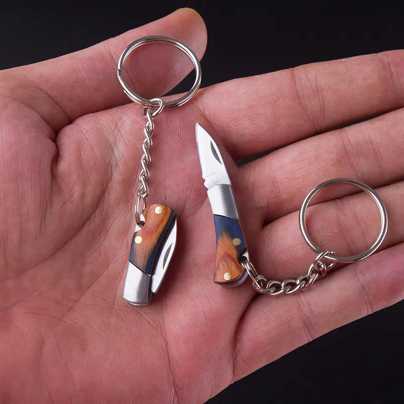 Portable Stainless steel mini folding knife ladies self-defense fruit knife keychain
Portable Stainless steel mini folding knife ladies self-defense fruit knife keychain