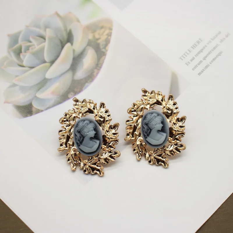 S925 Silver Needle New Fashion High Sense Popular Earrings Temperament Relief Retro Baroque Head Earrings Inlaid with Gemstones
S925 Silver Needle New Fashion High Sense Popular Earrings Temperament Relief Retro Baroque Head Earrings Inlaid with Gemstones