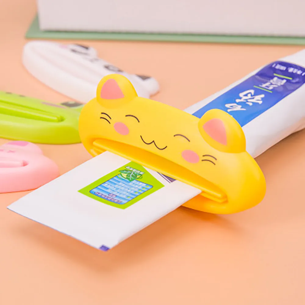 

HOT Plastic CartoonTube Rolling Holder Squeezer Toothpaste Dispenser Easy Use Press Squeezing Tool Home Bathroom Accessories