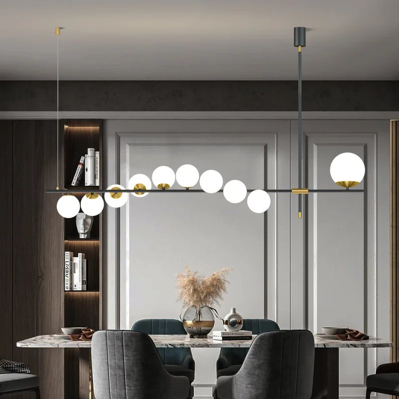 Nordic new modern restaurant chandelier net red creative personality light luxury dining table bar long simple household lamps
Nordic new modern restaurant chandelier net red creative personality light luxury dining table bar long simple household lamps