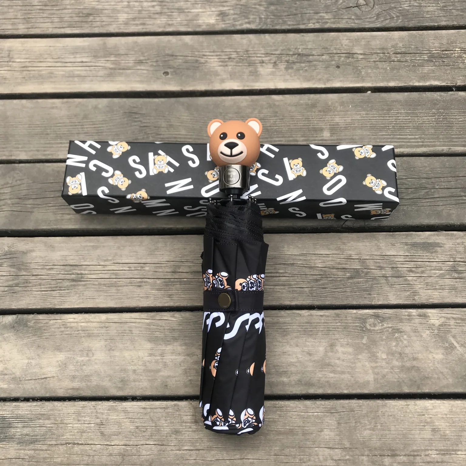 New bear umbrella automatic 30% folding umbrella bear umbrella handle with gift box for men and women general umbrella
New bear umbrella automatic 30% folding umbrella bear umbrella handle with gift box for men and women general umbrella