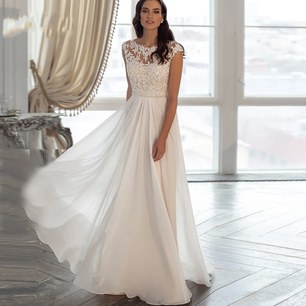 New Jewel Cap Sleeves Chiffon Beach Wedding Dresses 2021 Beaded Appliqued Boho Plus Size Bridal Gown Robe De Mairage
New Jewel Cap Sleeves Chiffon Beach Wedding Dresses 2021 Beaded Appliqued Boho Plus Size Bridal Gown Robe De Mairage