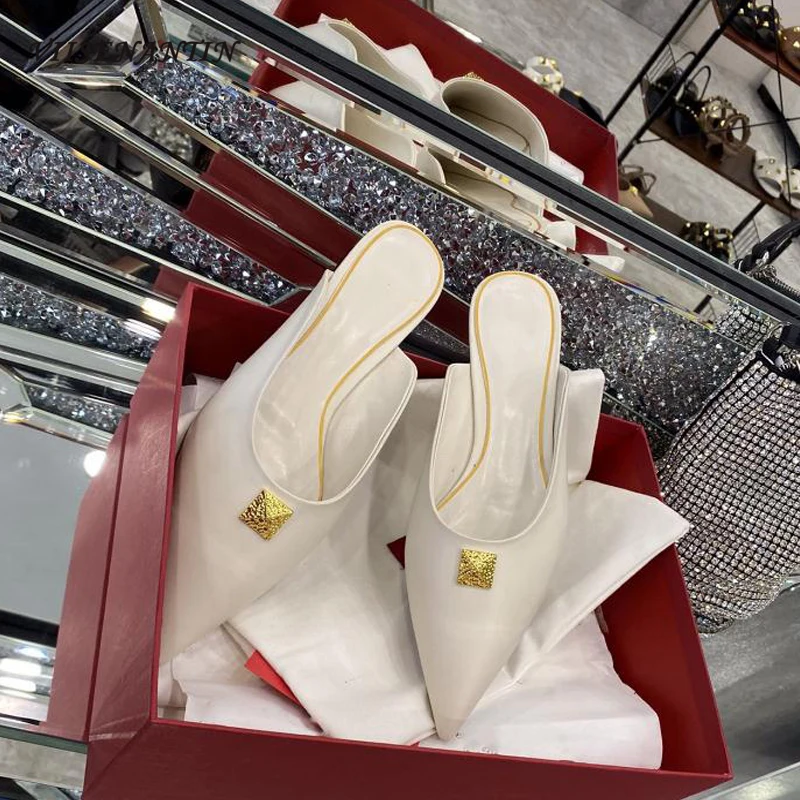 Summer new Muller flat half slippers female shallow mouth leather fashion pointed toe rivet ladies sandals and slippers 
Summer new Muller flat half slippers female shallow mouth leather fashion pointed toe rivet ladies sandals and slippers