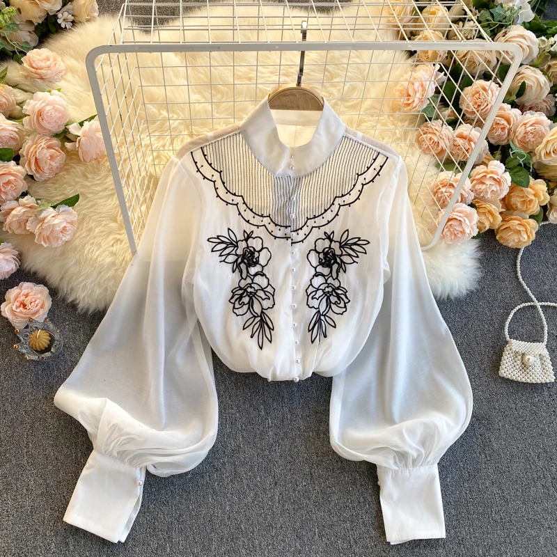 spring new coat female round collar hubble-bubble sleeve chiffon shirt embroidered with condole female competitors
spring new coat female round collar hubble-bubble sleeve chiffon shirt embroidered with condole female competitors