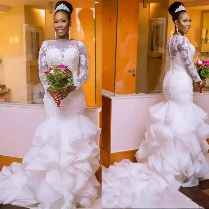 African Nigerian plus size long sleeves mermaid wedding dresses ruffles train bridal gowns lace apliques
African Nigerian plus size long sleeves mermaid wedding dresses ruffles train bridal gowns lace apliques