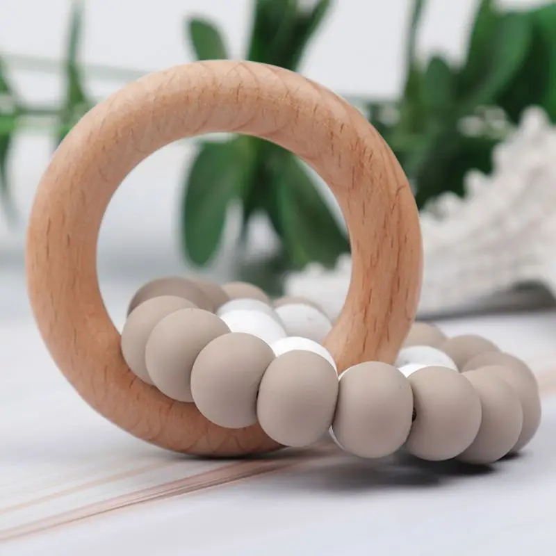 Baby Teether Bracelet Ring Boy Girl Beech Wooden Teething Rattle Toy Shower Gift 
Baby Teether Bracelet Ring Boy Girl Beech Wooden Teething Rattle Toy Shower Gift