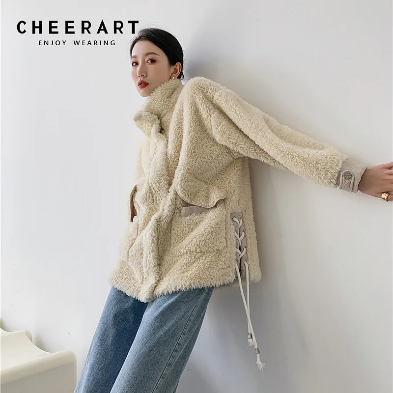 CHEERART Bandage Winter Faux Fur Coats And Jackets Women Beige Designer Lamb Fur Coat Furry Outerwear 2020 Korean Style
CHEERART Bandage Winter Faux Fur Coats And Jackets Women Beige Designer Lamb Fur Coat Furry Outerwear 2020 Korean Style