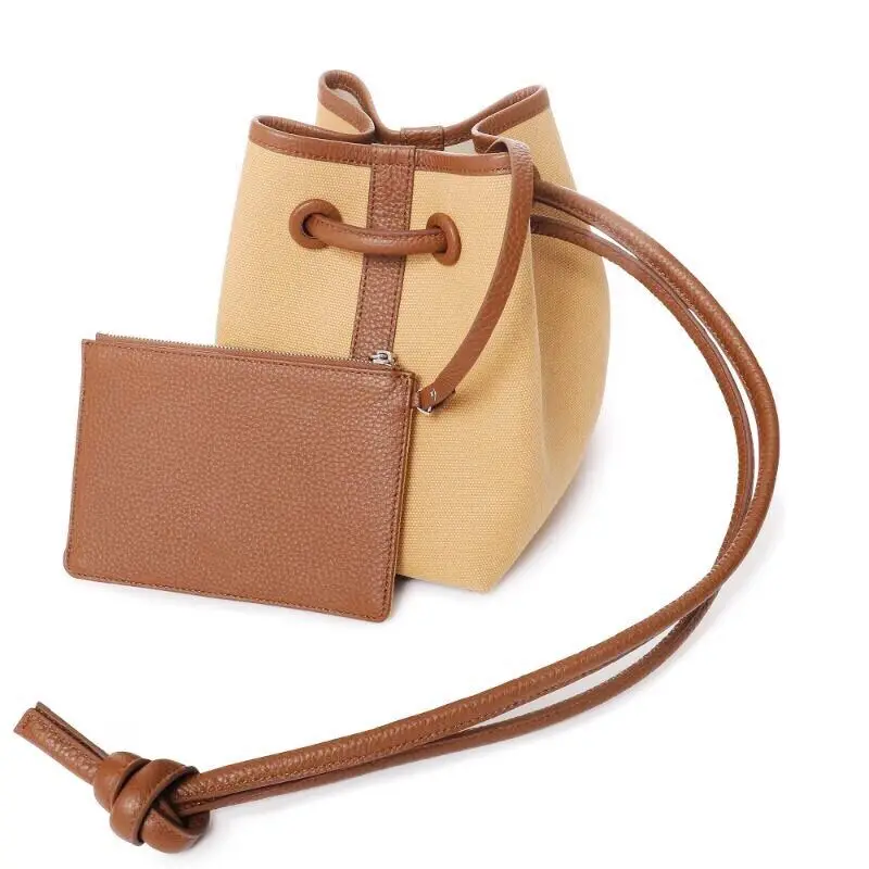Female mini luxury canvas bump leather bucket bag 2021 simple leather shoulder strap large knot single shoulder or diagonal bag
Female mini luxury canvas bump leather bucket bag 2021 simple leather shoulder strap large knot single shoulder or diagonal bag