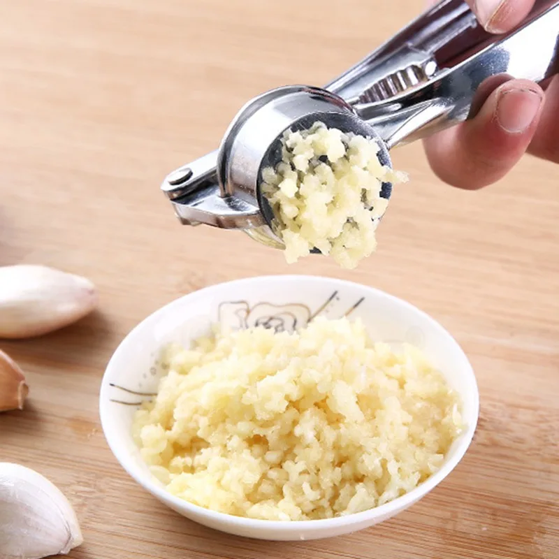 Stainless Steel Handheld Garlic Press Crusher Vegetables Ginger Squeezer Masher Kitchen Gadget
Stainless Steel Handheld Garlic Press Crusher Vegetables Ginger Squeezer Masher Kitchen Gadget