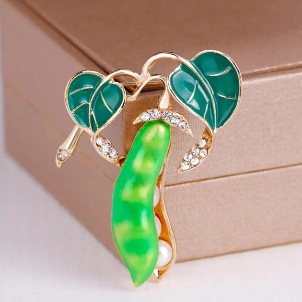 Pea Pod Shape Faux Pearl Rhinestone Inlaid Brooch Pin Women Shirt Collar Jewelry
Pea Pod Shape Faux Pearl Rhinestone Inlaid Brooch Pin Women Shirt Collar Jewelry