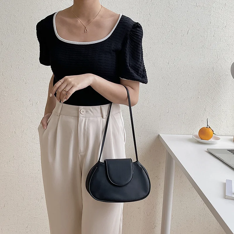 Magnetic buckle bag handbag high quality PU solid color single shoulder bag fashion personality oval flap underarm bag
Magnetic buckle bag handbag high quality PU solid color single shoulder bag fashion personality oval flap underarm bag