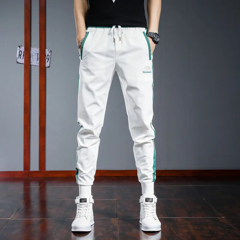Summer casual pants men's ice sports pants Korean Trend slim men's trousers black thin white stripe
Summer casual pants men's ice sports pants Korean Trend slim men's trousers black thin white stripe