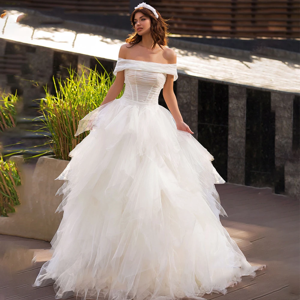 Romantic Sleeveless Tulle Wedding Dress Boat Neck Off the Shoulder Zipper Back Court Train Bridal Gowns 2021 Vestido De Noiva
Romantic Sleeveless Tulle Wedding Dress Boat Neck Off the Shoulder Zipper Back Court Train Bridal Gowns 2021 Vestido De Noiva