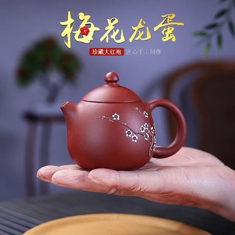Чайник Yixing из фиолетового песка, сырая руда Dahongpao, ручная роспись, слива, слива, аромат дракона, яйцо, горшок
Чайник Yixing из фиолетового песка, сырая руда Dahongpao, ручная роспись, слива, слива, аромат дракона, яйцо, горшок