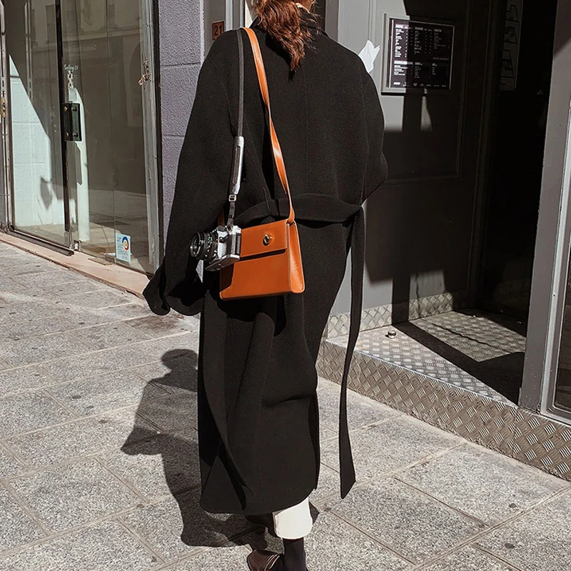 Autumn and winter women's coat casual solid color double-breasted belt decoration loose long coat
Autumn and winter women's coat casual solid color double-breasted belt decoration loose long coat
