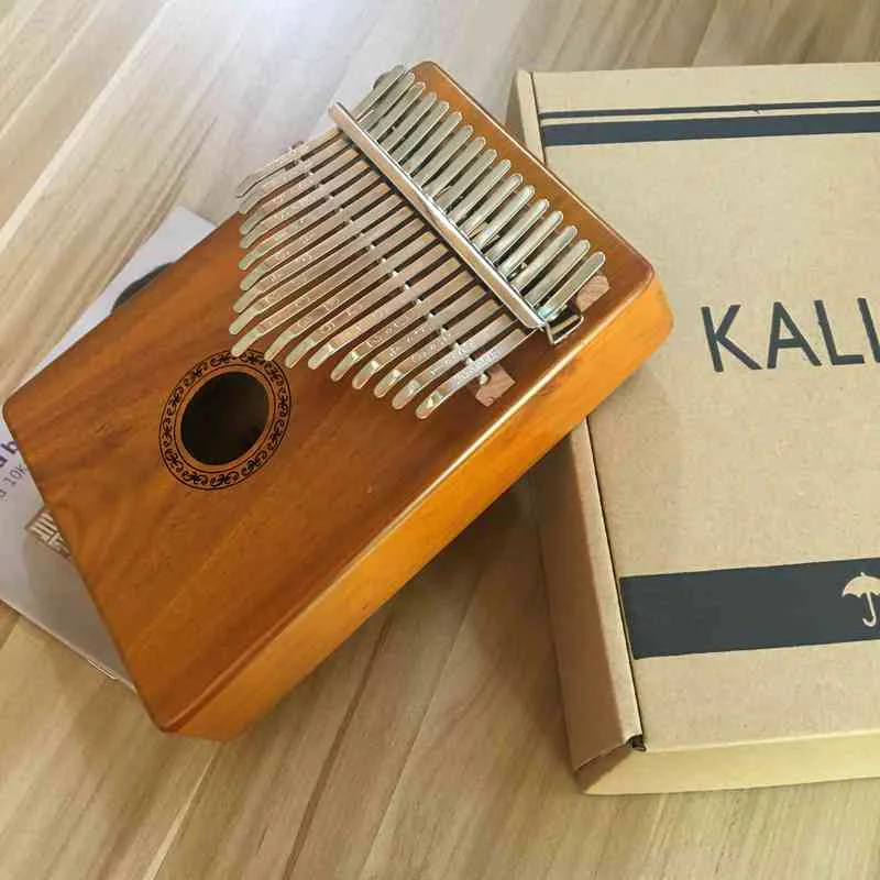 17 Keys Kalimba High Quality Musical Instruments Music Box Kalimba Piano Gift with Song instruction book 12cm*18.5cm*14cm*3.5cm
17 Keys Kalimba High Quality Musical Instruments Music Box Kalimba Piano Gift with Song instruction book 12cm*18.5cm*14cm*3.5cm