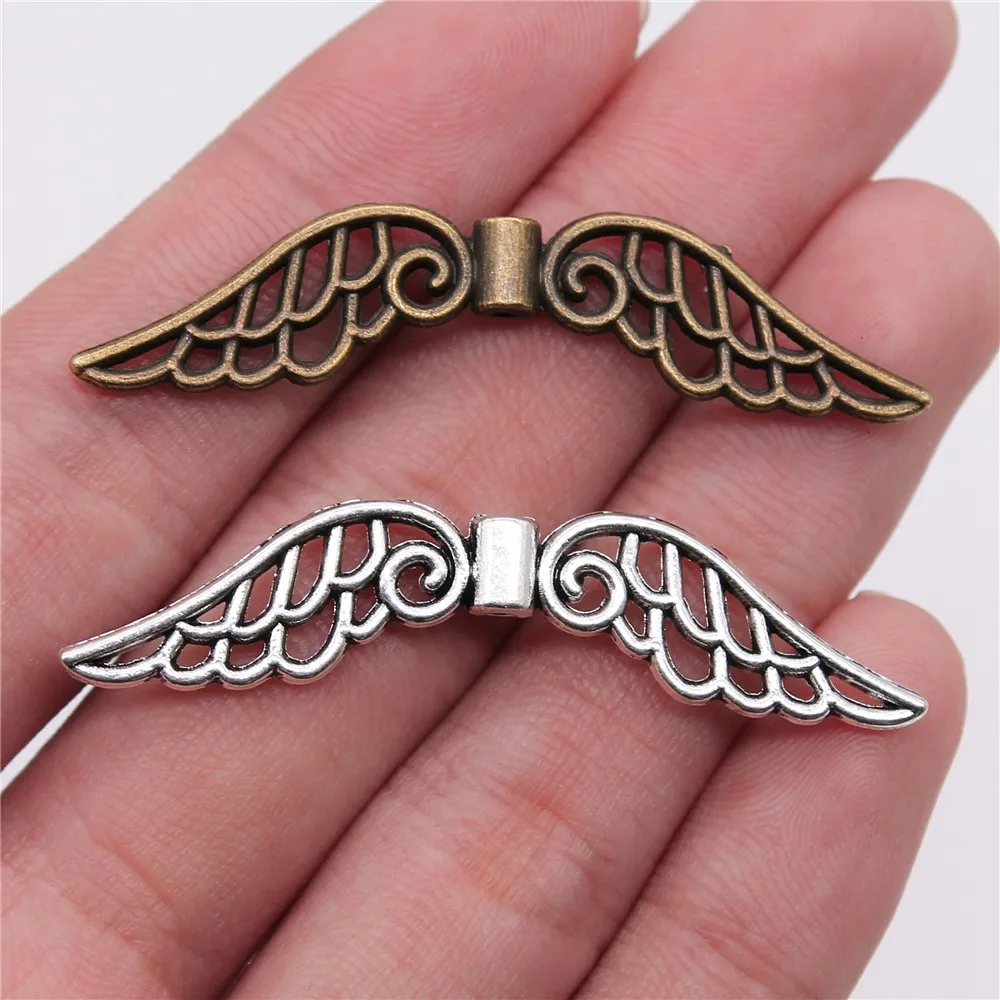 Wing Alloy Small Pendant Angel Wing Interval Bead Wing Eyelet Jewelry Charm Small Accessories
Wing Alloy Small Pendant Angel Wing Interval Bead Wing Eyelet Jewelry Charm Small Accessories
