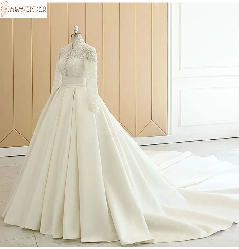 Ivory Long Sleeve Muslim Wedding Dresses High Neck Draped Skirt Lace Appliques vestidos de novia Pearls Beading Wedding Gowns
Ivory Long Sleeve Muslim Wedding Dresses High Neck Draped Skirt Lace Appliques vestidos de novia Pearls Beading Wedding Gowns