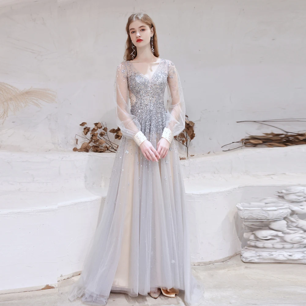 2021 Elegant White Tulle Sleeves Rhinestones Evening Dresses Crystal Beads Backless Prom Gowns V-Neck Court Train Vestido
2021 Elegant White Tulle Sleeves Rhinestones Evening Dresses Crystal Beads Backless Prom Gowns V-Neck Court Train Vestido