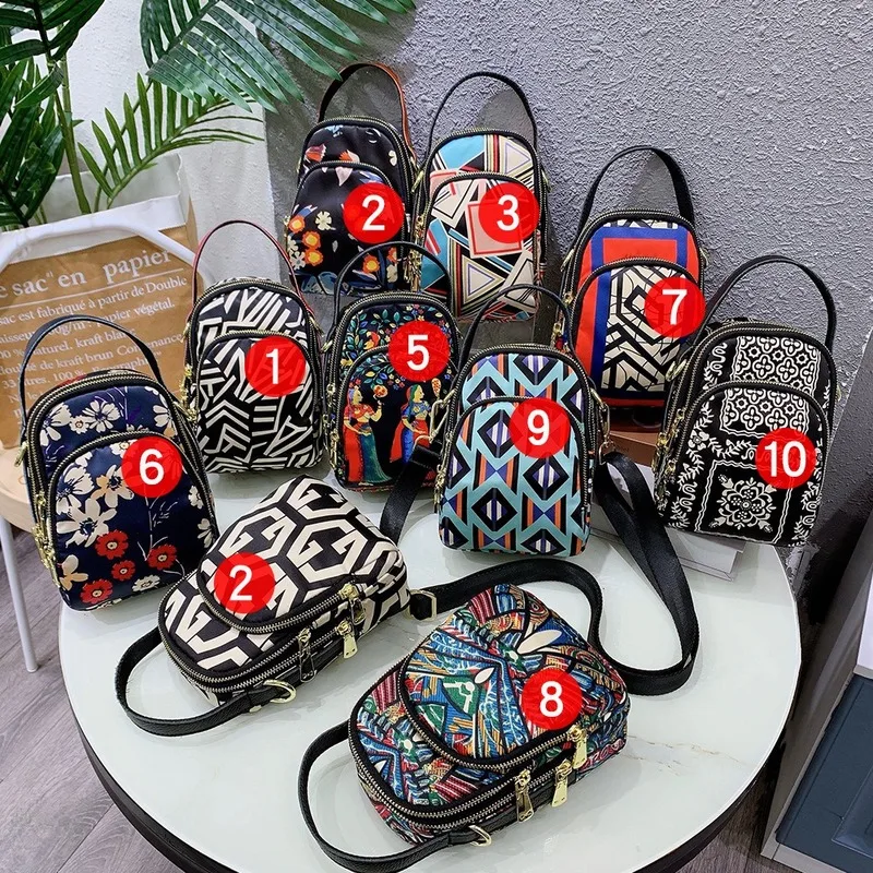 Women Small Phone Handbag Printing High Fashion Brand Design Oxford Handle Strap Cross Body Casual Purse
Women Small Phone Handbag Printing High Fashion Brand Design Oxford Handle Strap Cross Body Casual Purse