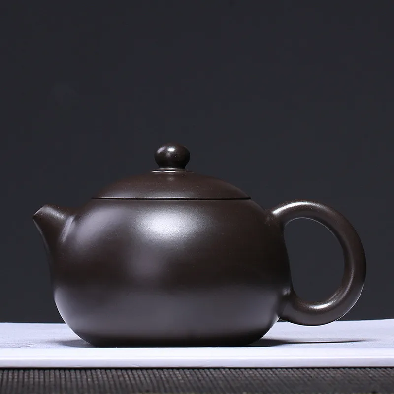 Authentic Yixing Xishi Tea pot Purple Clay filter Teapot Ore Black mud beauty kettle Master handmade Teaware Customized 220ml 
Authentic Yixing Xishi Tea pot Purple Clay filter Teapot Ore Black mud beauty kettle Master handmade Teaware Customized 220ml