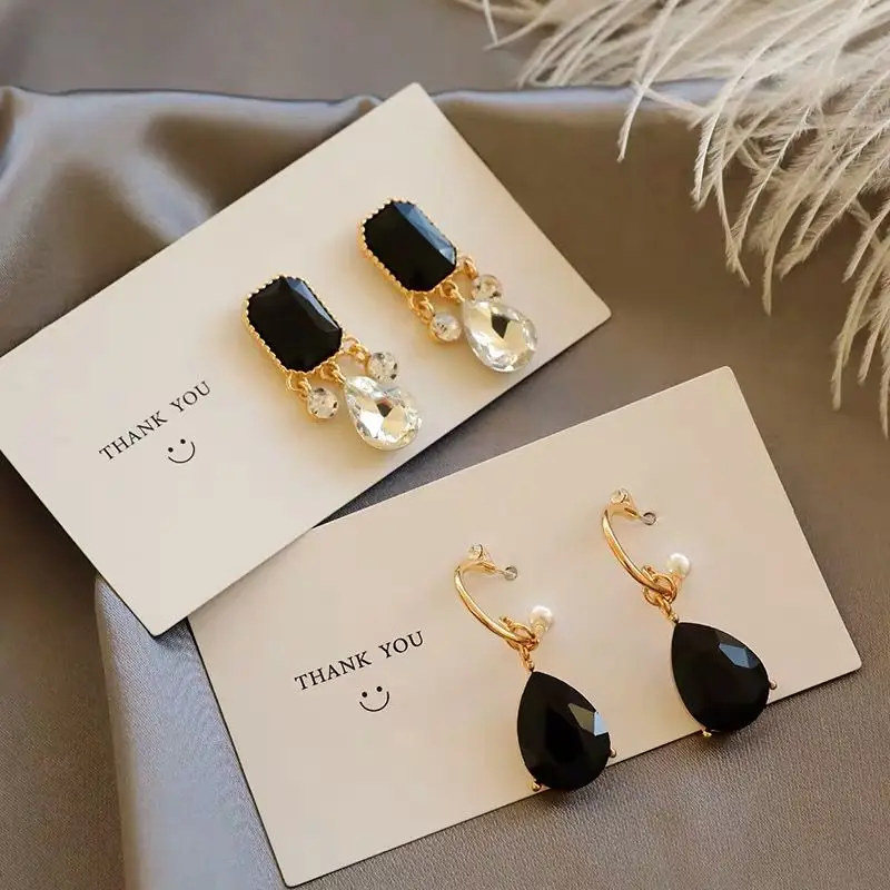 Retro hook black earrings drona Hotel IU Korean star with a high sense of the same female earrings drop
Retro hook black earrings drona Hotel IU Korean star with a high sense of the same female earrings drop