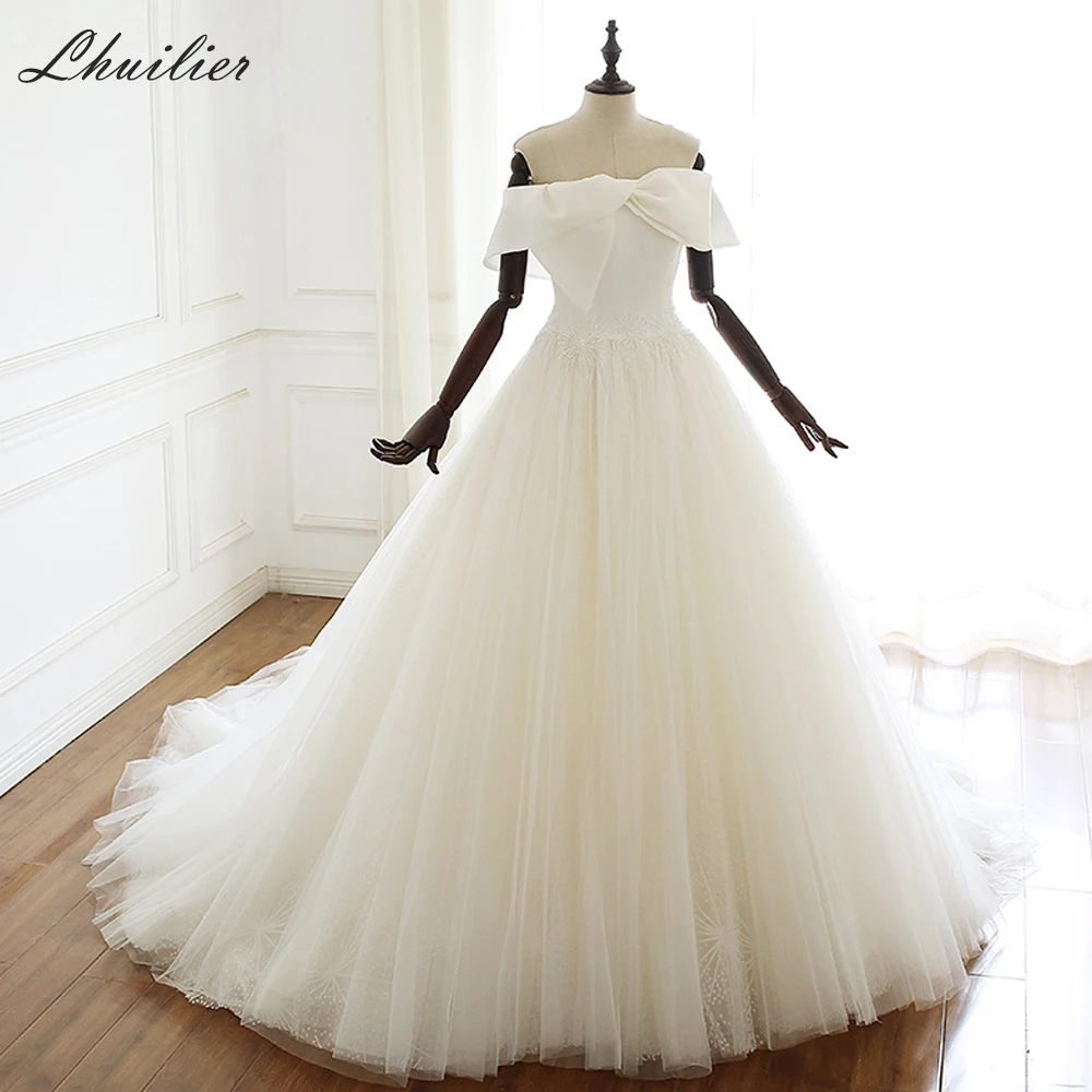 Lhuilier A-line Boat Neck Tulle Wedding Dresses 2020 Elegant Off the Shoulder Floor Length Court Train Beaded Bridal Dress
Lhuilier A-line Boat Neck Tulle Wedding Dresses 2020 Elegant Off the Shoulder Floor Length Court Train Beaded Bridal Dress